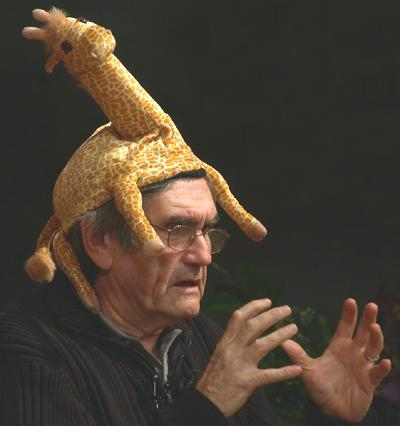 Marshall Rosenberg wearing his giraffe hat, the symbol of Nonviolent Communication